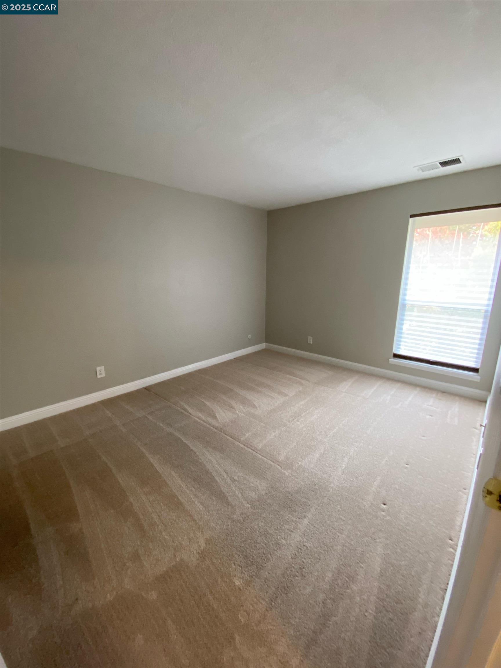 1544 Bailey Road, Unit 6 Concord, CA 94521 - Photo 12 of 18 an empty room with a window