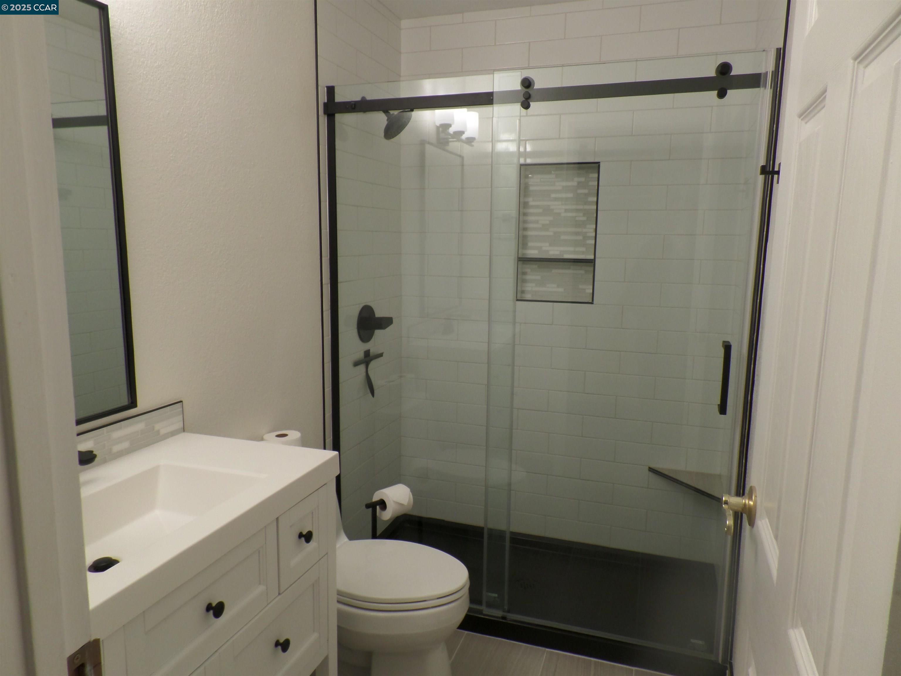 1544 Bailey Road, Unit 6 Concord, CA 94521 - Photo 14 of 18 a bathroom with a shower toilet and sink