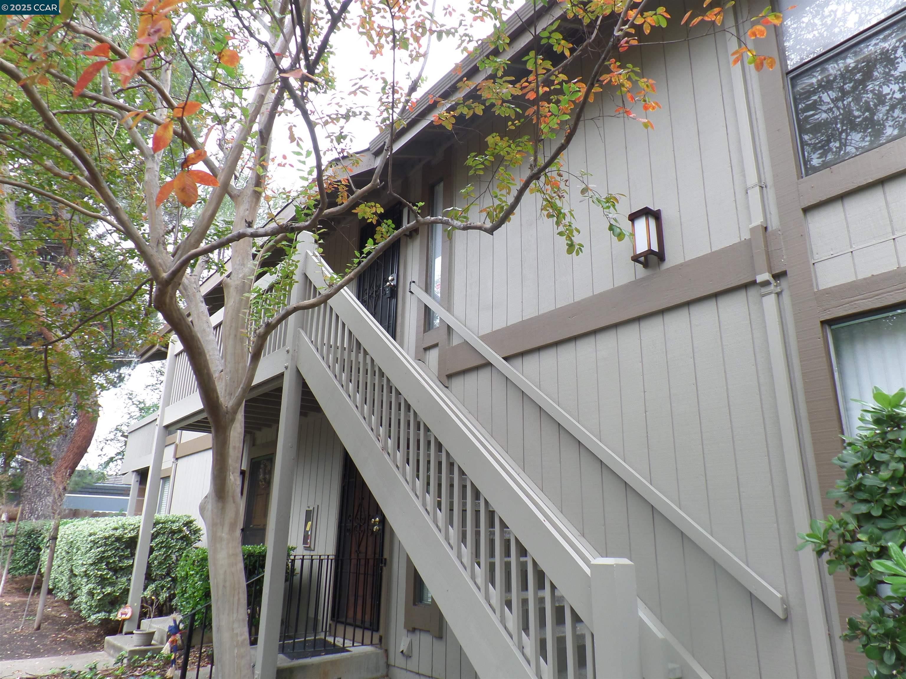 1544 Bailey Road, Unit 6 Concord, CA 94521 - Photo 3 of 18 a view of balcony with wooden stairs and deck