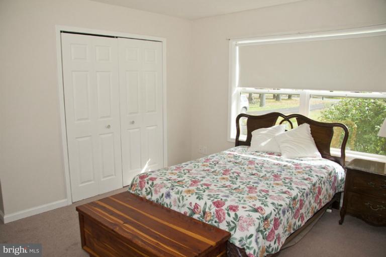 3914 Briar Point Road Middle River, MD 21220 - Photo 14 of 30 a bedroom with a bed and a window