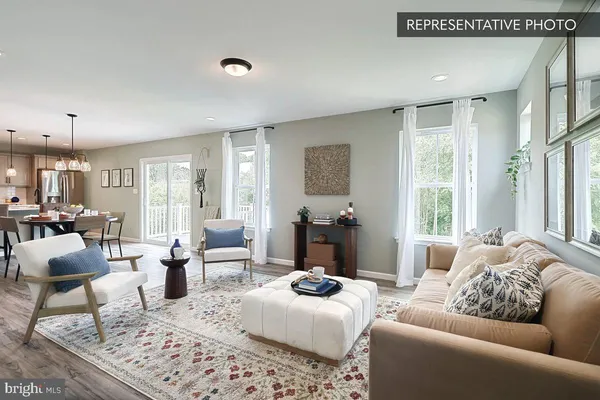 a bedroom with furniture or couch and a large window
