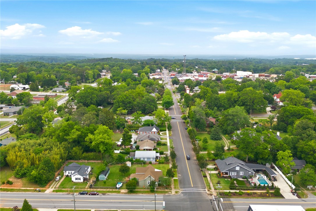 314 South Fairplay Street Seneca, SC 29678 - Photo 48 of 50 An aerial view showcases a vibrant community with lush trees and well-maintained homes.