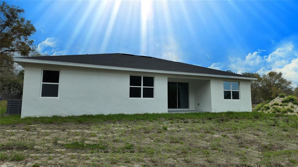 7 Spring Pass Ocala, FL 34472 - Photo 9 of 35 a house with trees in the background