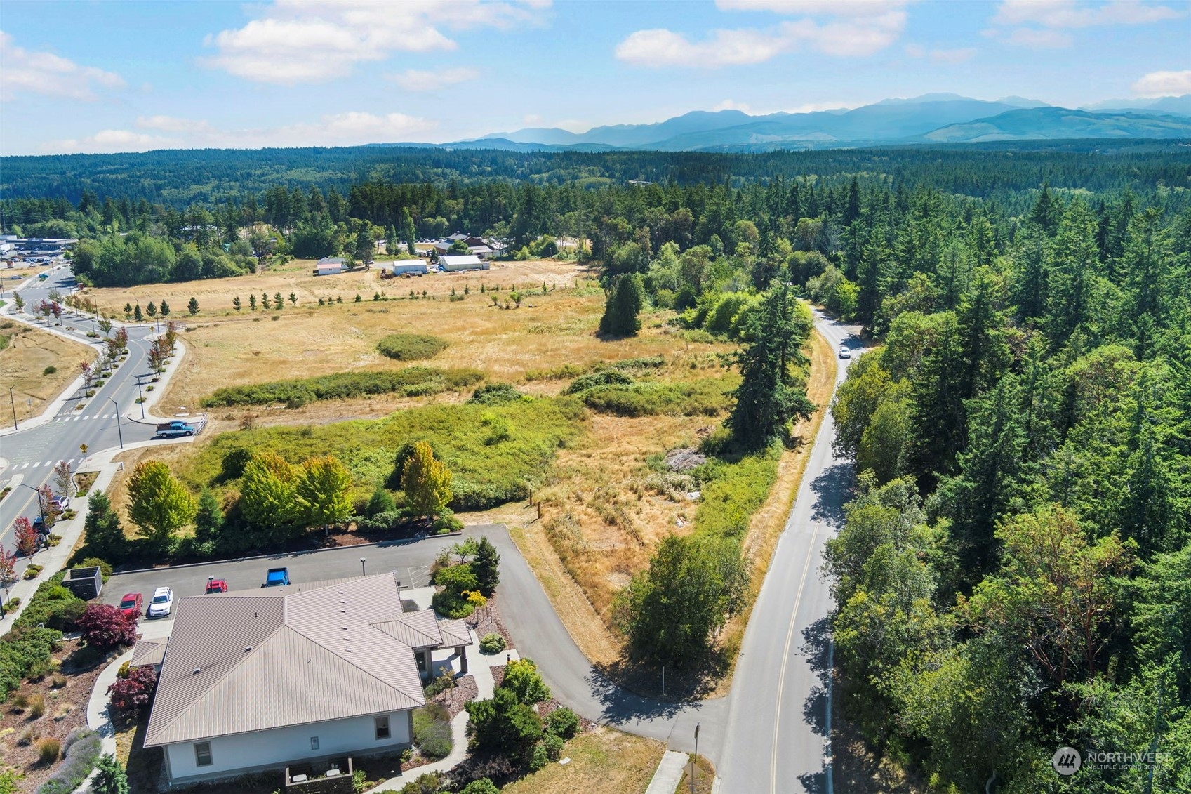 999 Discovery Road Port Townsend, WA 98368 - Photo 4 of 14 an aerial view of a house with a yard and lake view