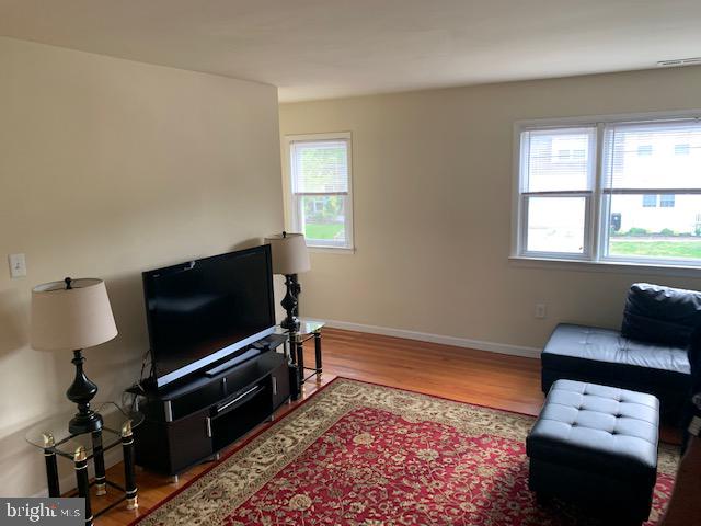 95 Linden Avenue, Unit B Pitman, NJ 08071 - Photo 11 of 15 a living room with furniture and a flat screen tv