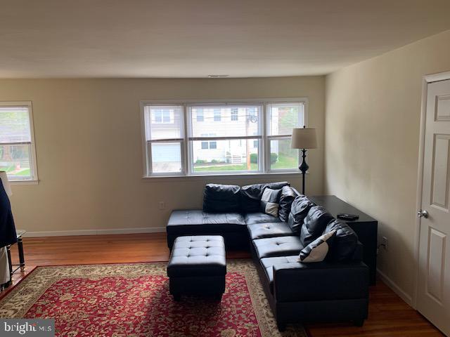 95 Linden Avenue, Unit B Pitman, NJ 08071 - Photo 12 of 15 a living room with furniture and a window