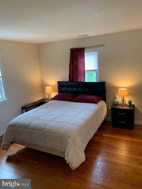 95 Linden Avenue, Unit B Pitman, NJ 08071 - Photo 13 of 15 a bedroom with a bed and a lamp