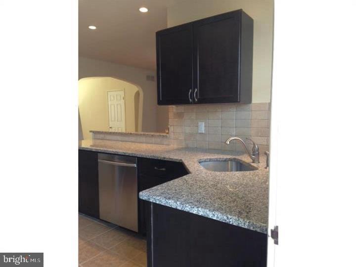 95 Linden Avenue, Unit B Pitman, NJ 08071 - Photo 5 of 15 a kitchen with a sink and a mirror