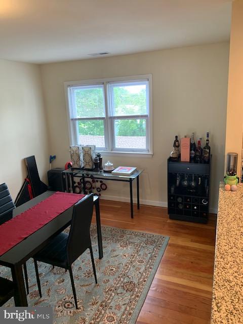95 Linden Avenue, Unit B Pitman, NJ 08071 - Photo 9 of 15 a bed room with a bed and a table