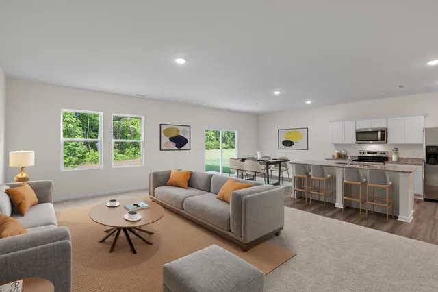 a living room with furniture and windows