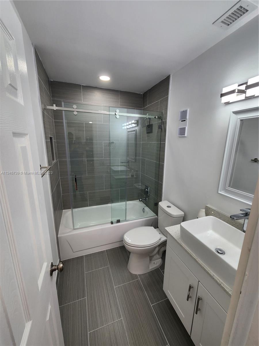 11603 Timbers Way Boca Raton, FL 33428 - Photo 17 of 48 a bathroom with a sink toilet and shower