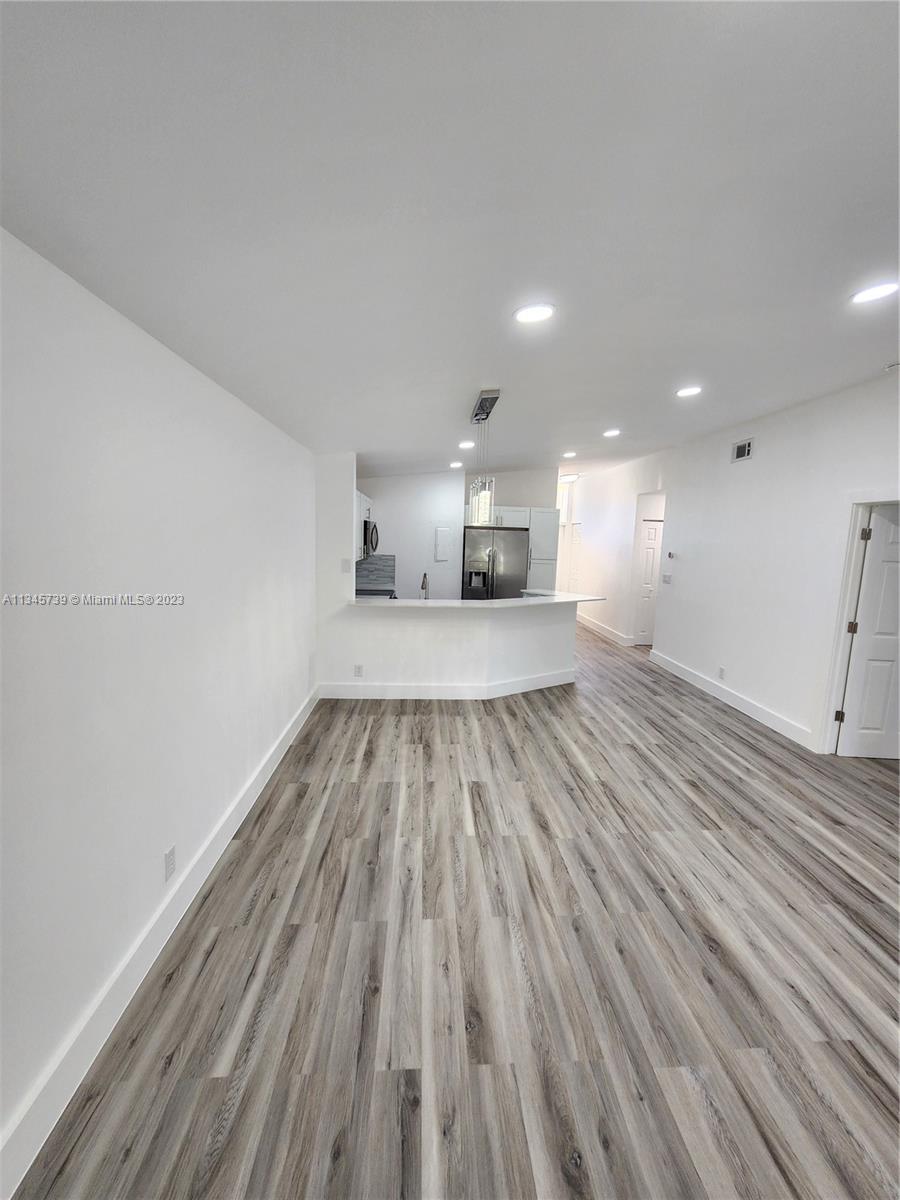 11603 Timbers Way Boca Raton, FL 33428 - Photo 24 of 48 a view of a room with wooden floor