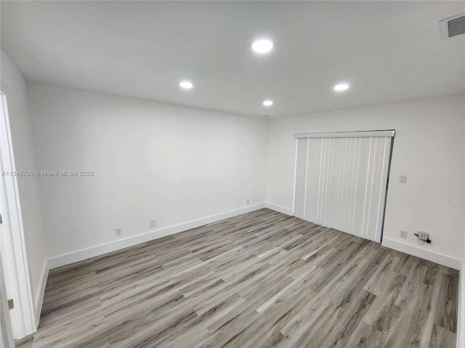 11603 Timbers Way Boca Raton, FL 33428 - Photo 27 of 48 a view of room with wooden floor