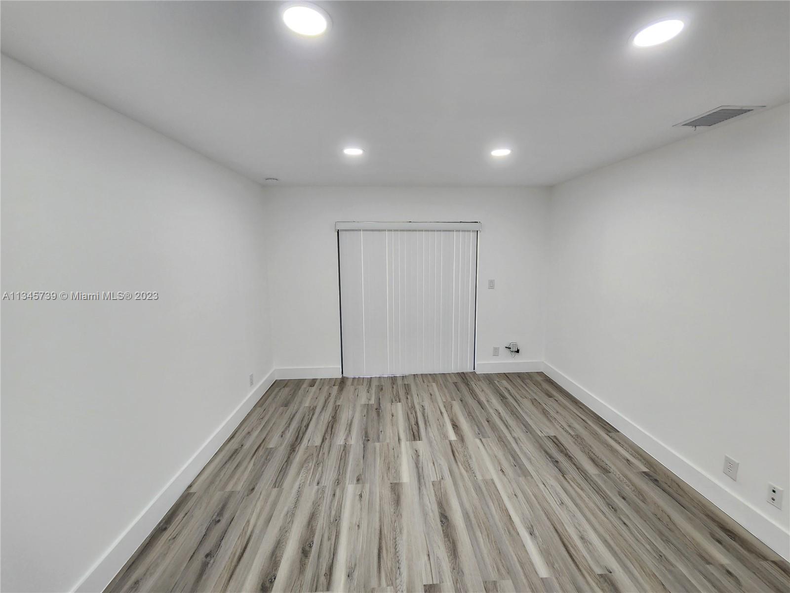 11603 Timbers Way Boca Raton, FL 33428 - Photo 28 of 48 a view of an empty room and wooden floor