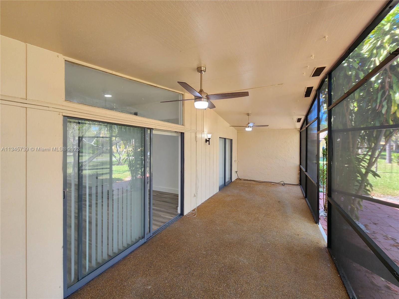 11603 Timbers Way Boca Raton, FL 33428 - Photo 34 of 48 a view of a hallway with a large window