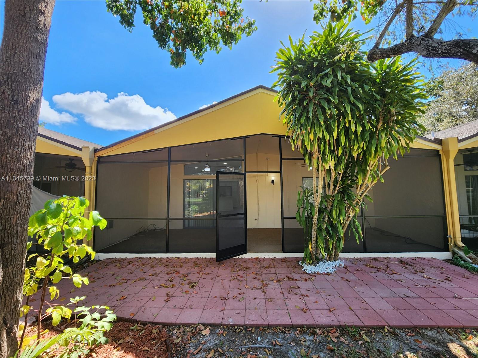 11603 Timbers Way Boca Raton, FL 33428 - Photo 36 of 48 a front view of a house with garden