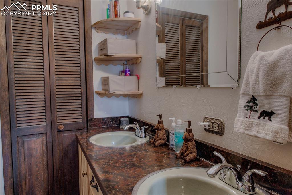 176 Cheyenne Road Alma, CO 80420 - Photo 20 of 50 a kitchen with a sink a cabinets and a window