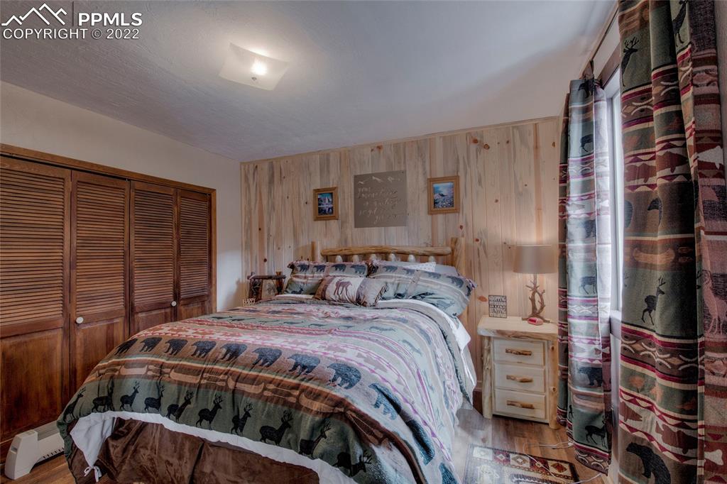 176 Cheyenne Road Alma, CO 80420 - Photo 22 of 50 a bedroom with a bed and a walk in closet