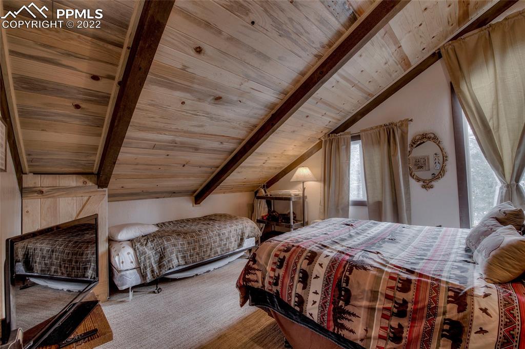 176 Cheyenne Road Alma, CO 80420 - Photo 29 of 50 a bedroom with bed and wooden floor
