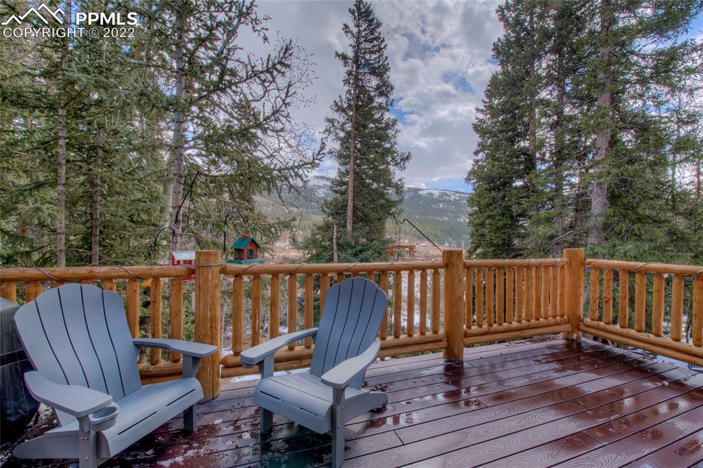 176 Cheyenne Road Alma, CO 80420 - Photo 33 of 50 a view of a wooden deck with furniture
