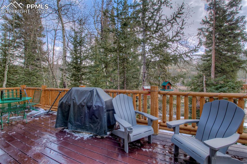 176 Cheyenne Road Alma, CO 80420 - Photo 34 of 50 a view of deck with wooden floor and outdoor seating
