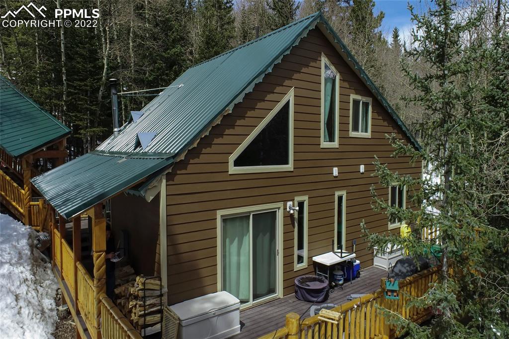 176 Cheyenne Road Alma, CO 80420 - Photo 44 of 50 a backyard of a house with seating space