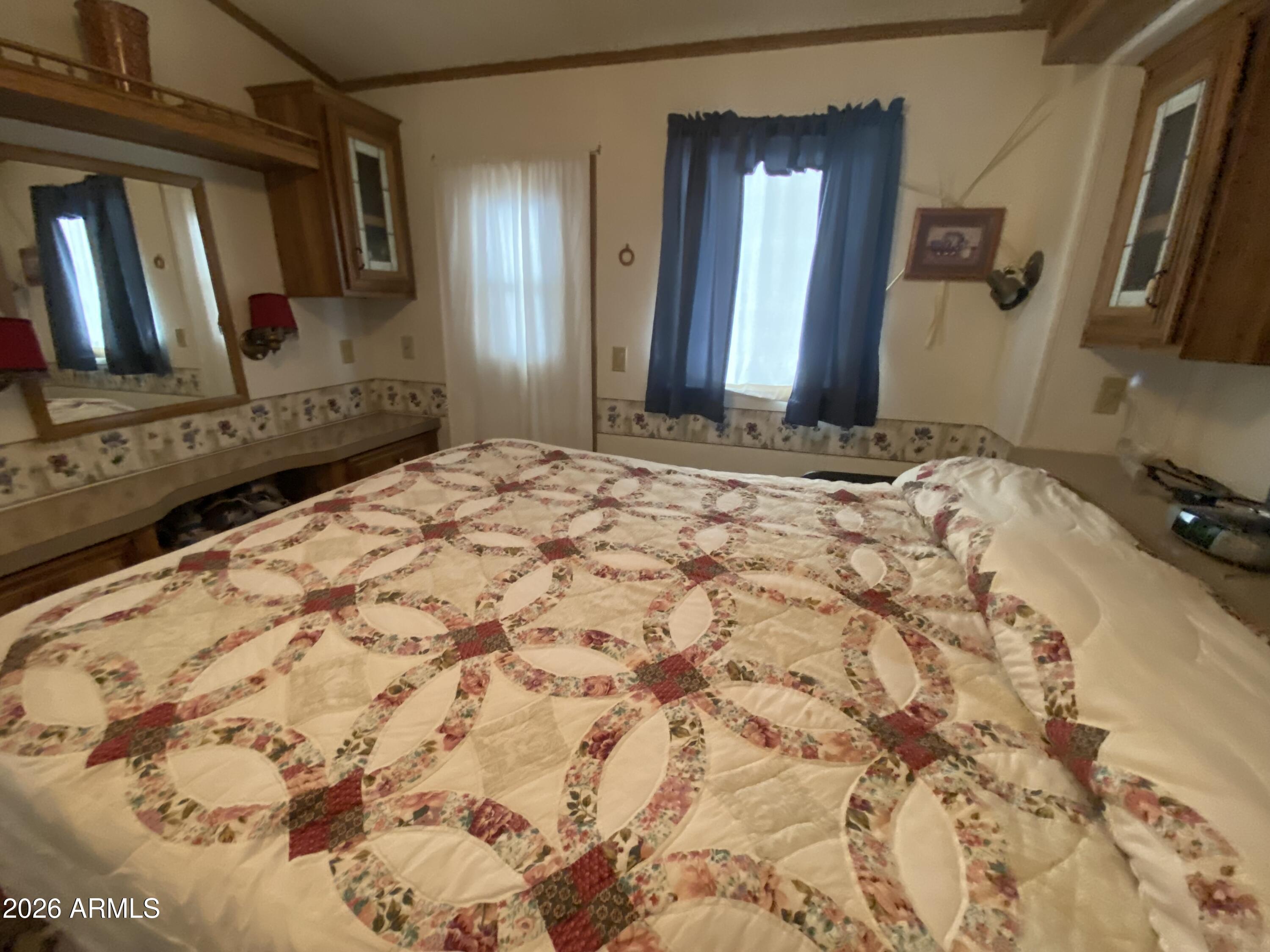 1328 West Inuit Avenue Apache Junction, AZ 85119 - Photo 13 of 45 a bathroom with a sink and a mirror
