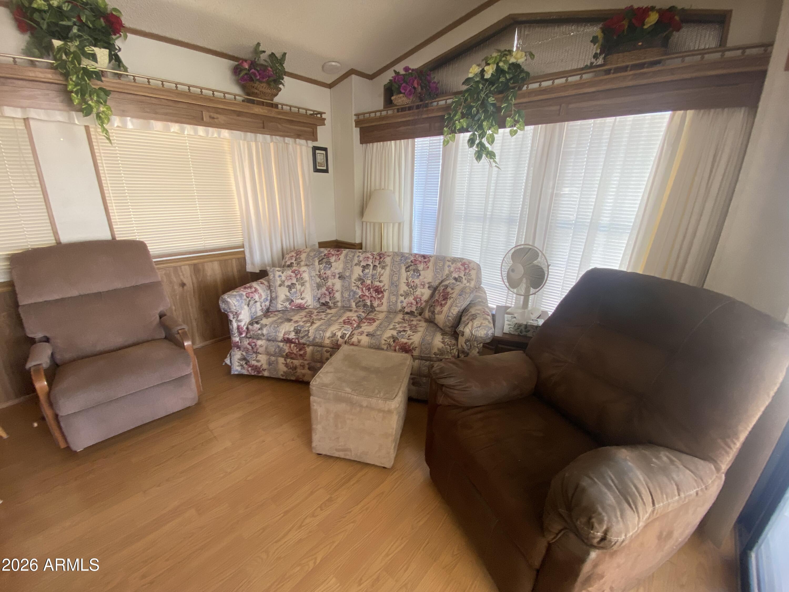 1328 West Inuit Avenue Apache Junction, AZ 85119 - Photo 22 of 45 a living room with furniture and a window