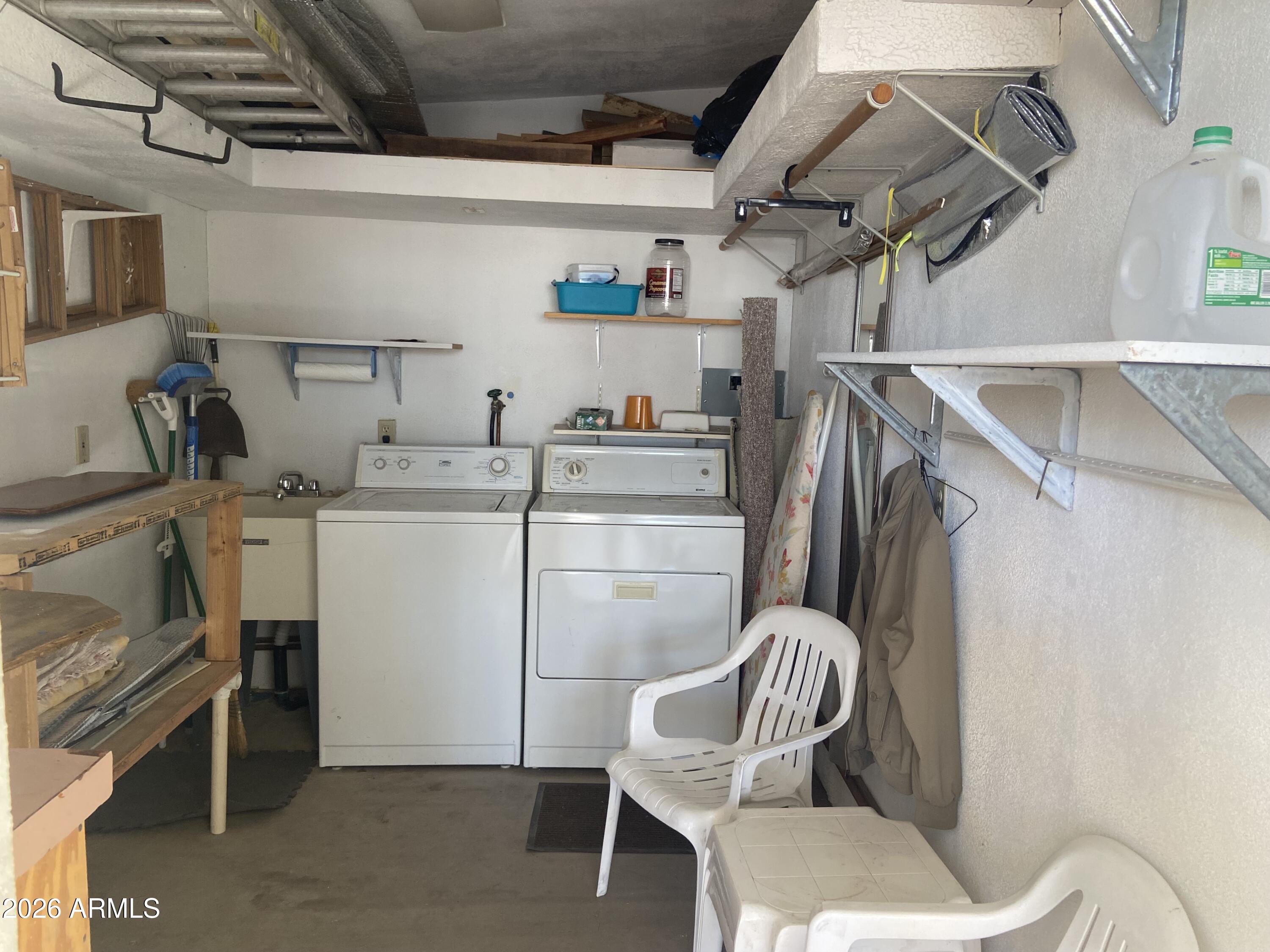 1328 West Inuit Avenue Apache Junction, AZ 85119 - Photo 28 of 45 a utility room with dryer and washer