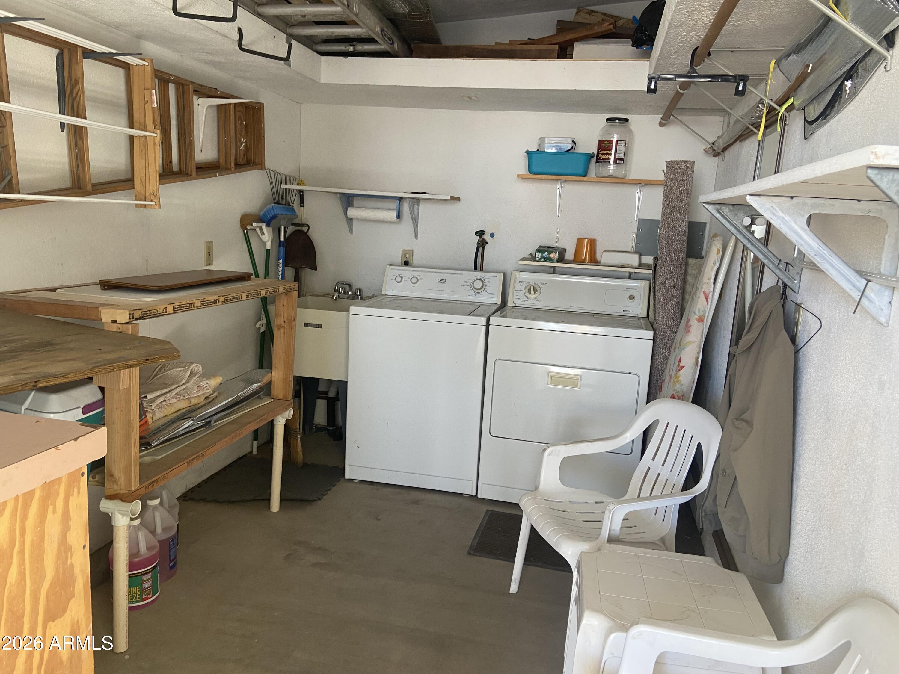 1328 West Inuit Avenue Apache Junction, AZ 85119 - Photo 29 of 45 a room with storage and utility