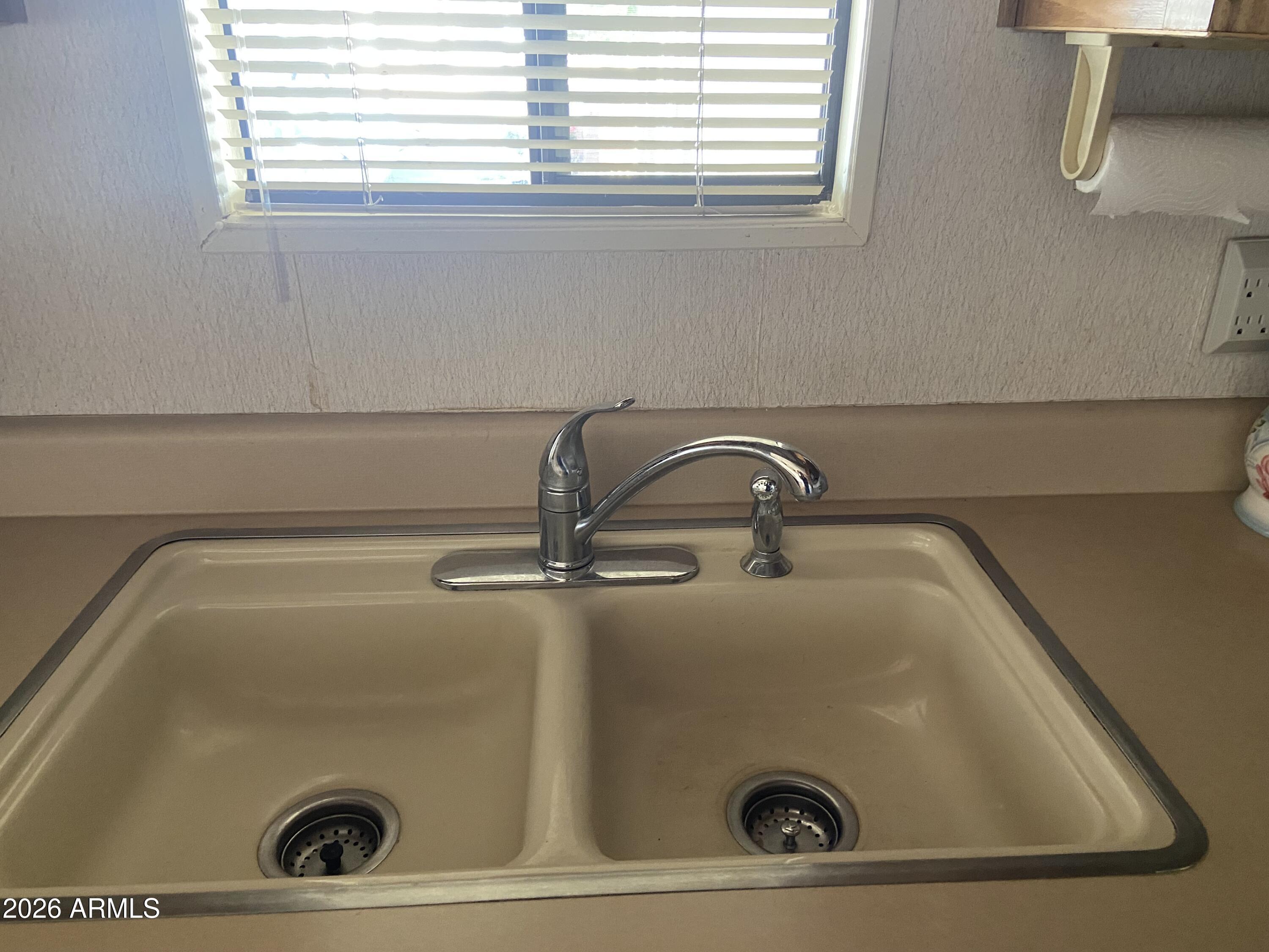 1328 West Inuit Avenue Apache Junction, AZ 85119 - Photo 30 of 45 a close view of sink and window