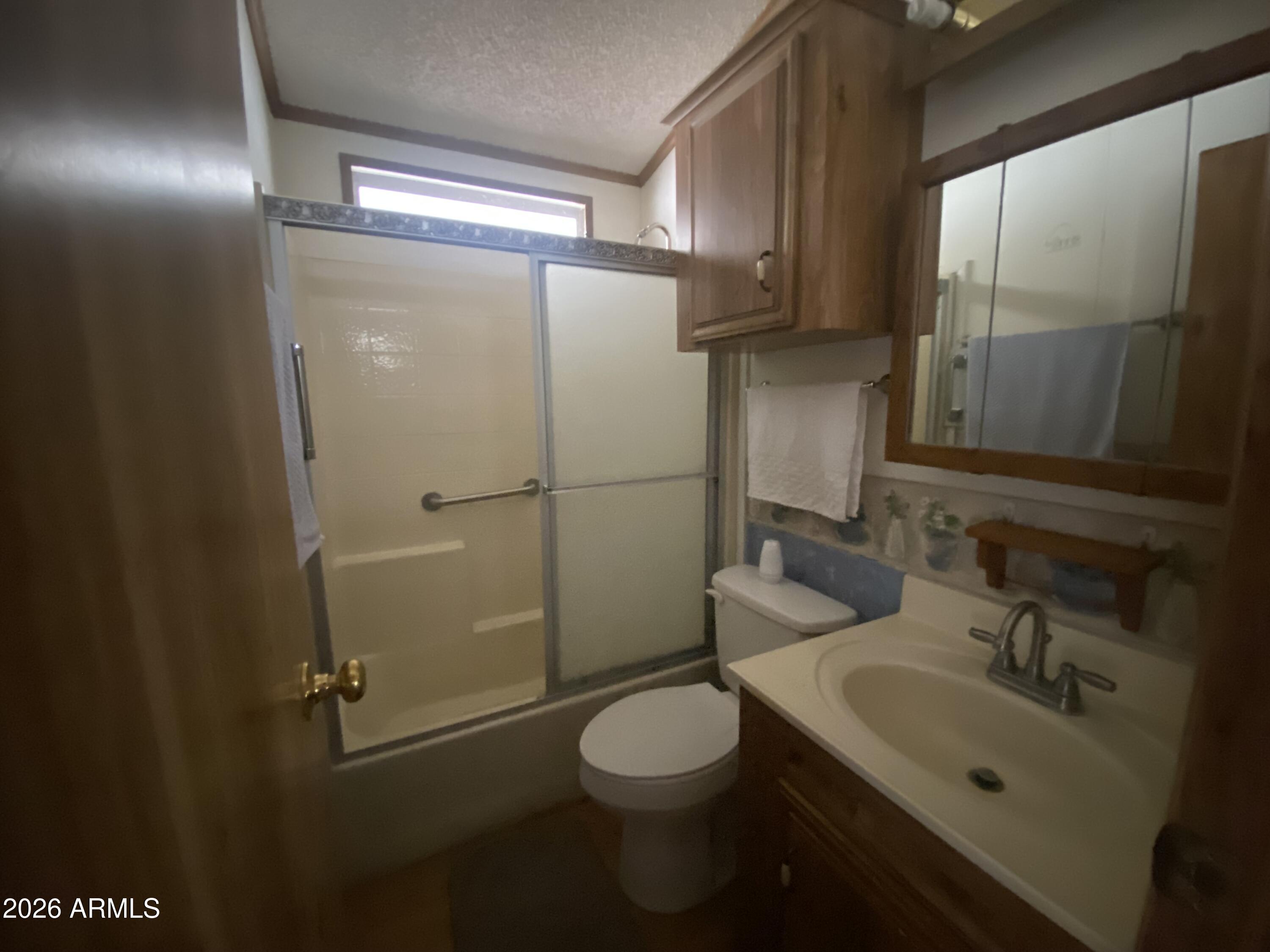 1328 West Inuit Avenue Apache Junction, AZ 85119 - Photo 37 of 45 a bathroom with a sink toilet and shower