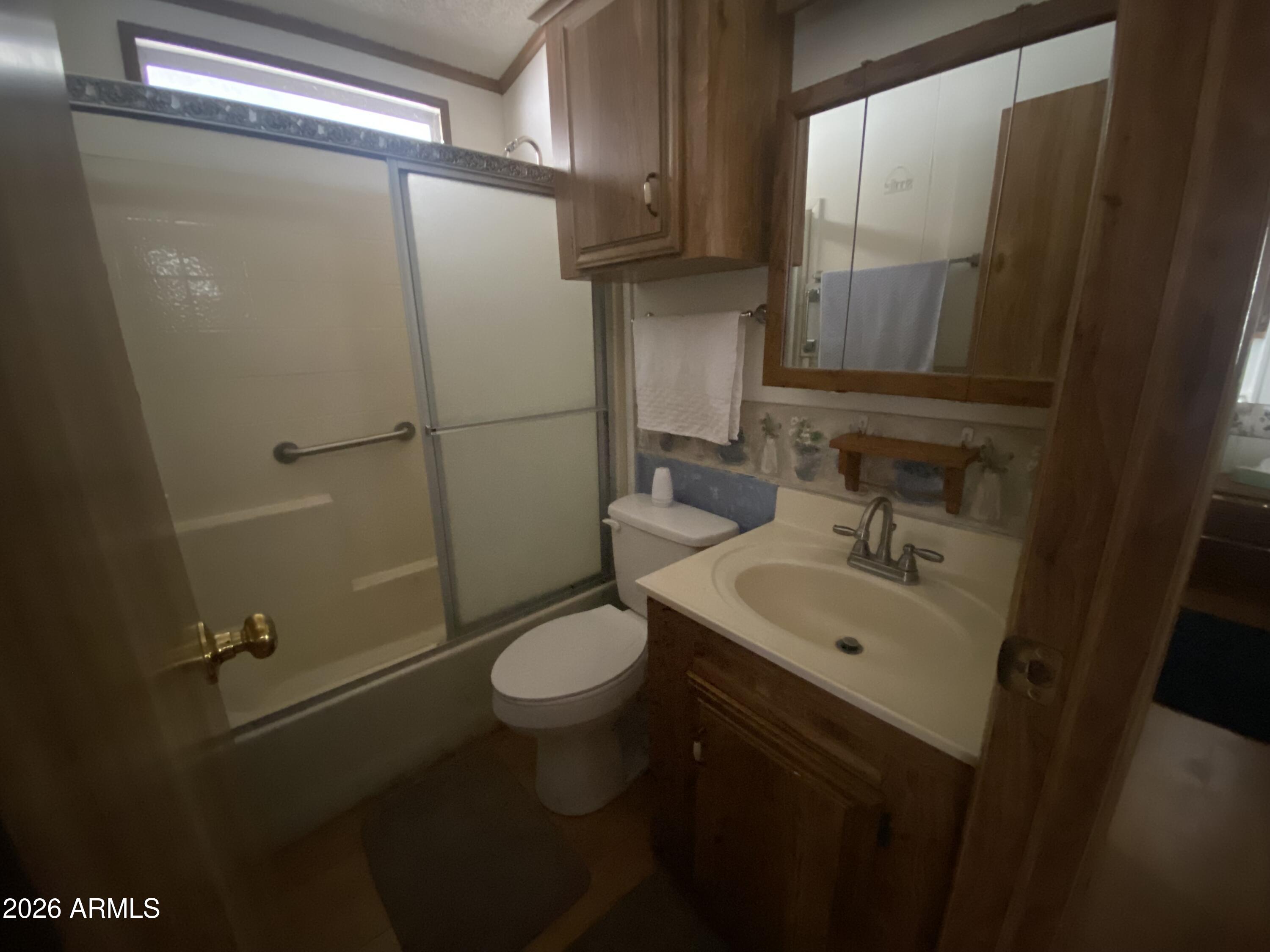 1328 West Inuit Avenue Apache Junction, AZ 85119 - Photo 40 of 45 a bathroom with a sink toilet and shower