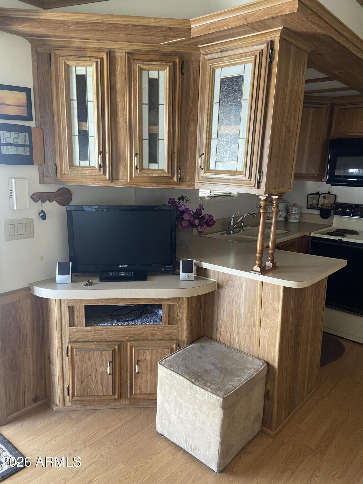 1328 West Inuit Avenue Apache Junction, AZ 85119 - Photo 41 of 45 a kitchen with a stove and a sink