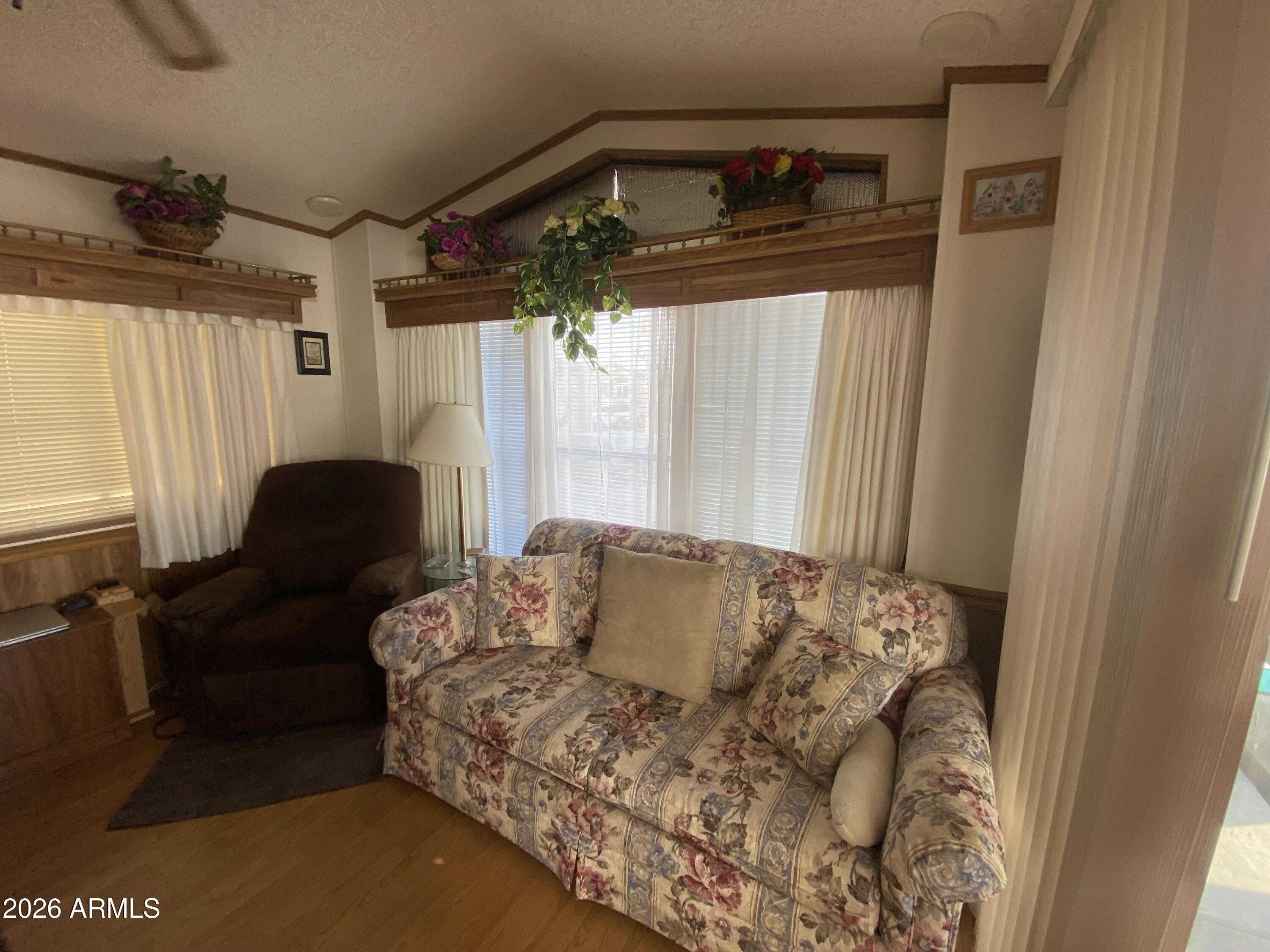 1328 West Inuit Avenue Apache Junction, AZ 85119 - Photo 7 of 45 a living room with furniture and a window