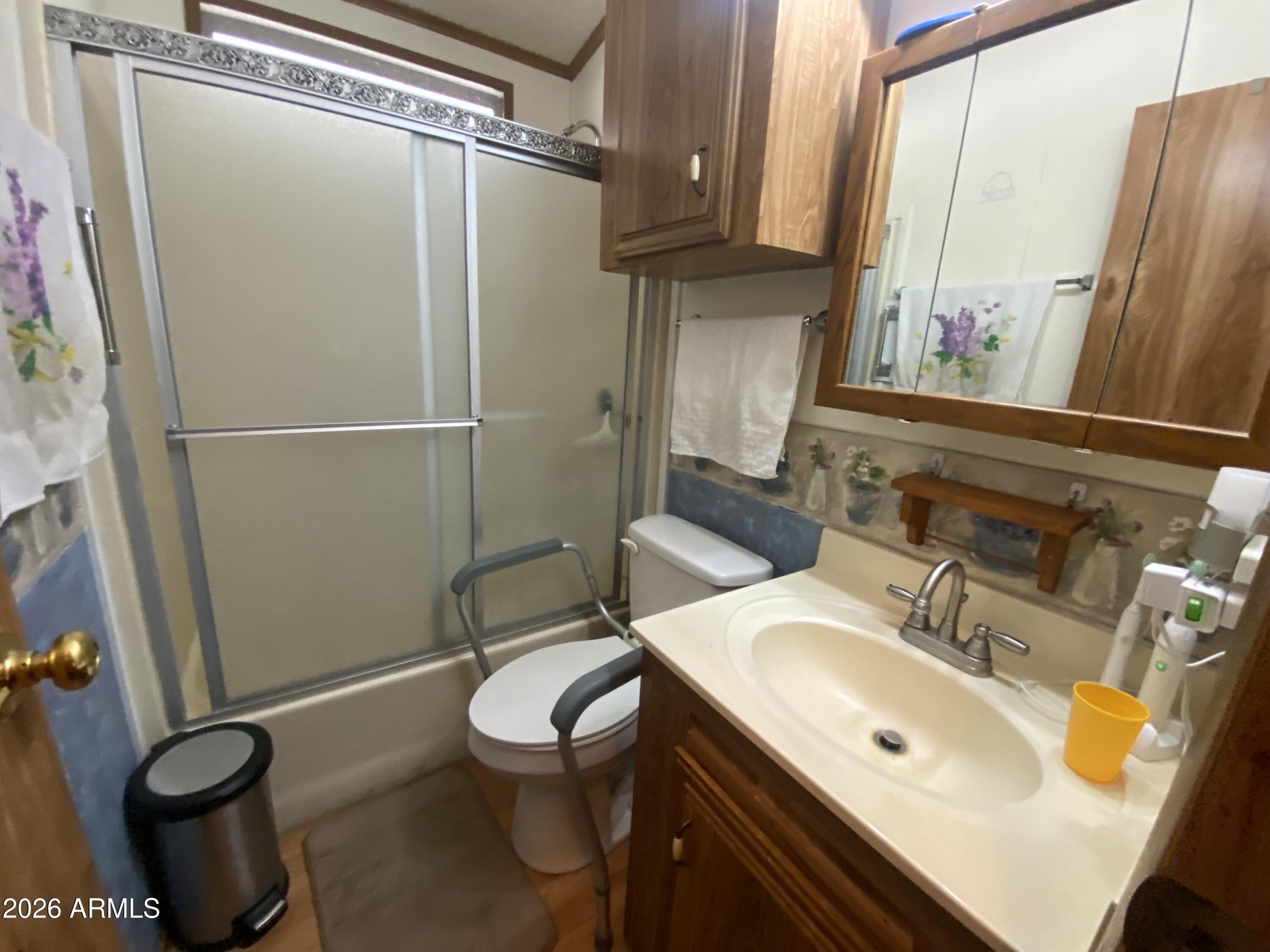 1328 West Inuit Avenue Apache Junction, AZ 85119 - Photo 10 of 45 a bathroom with a sink toilet and shower