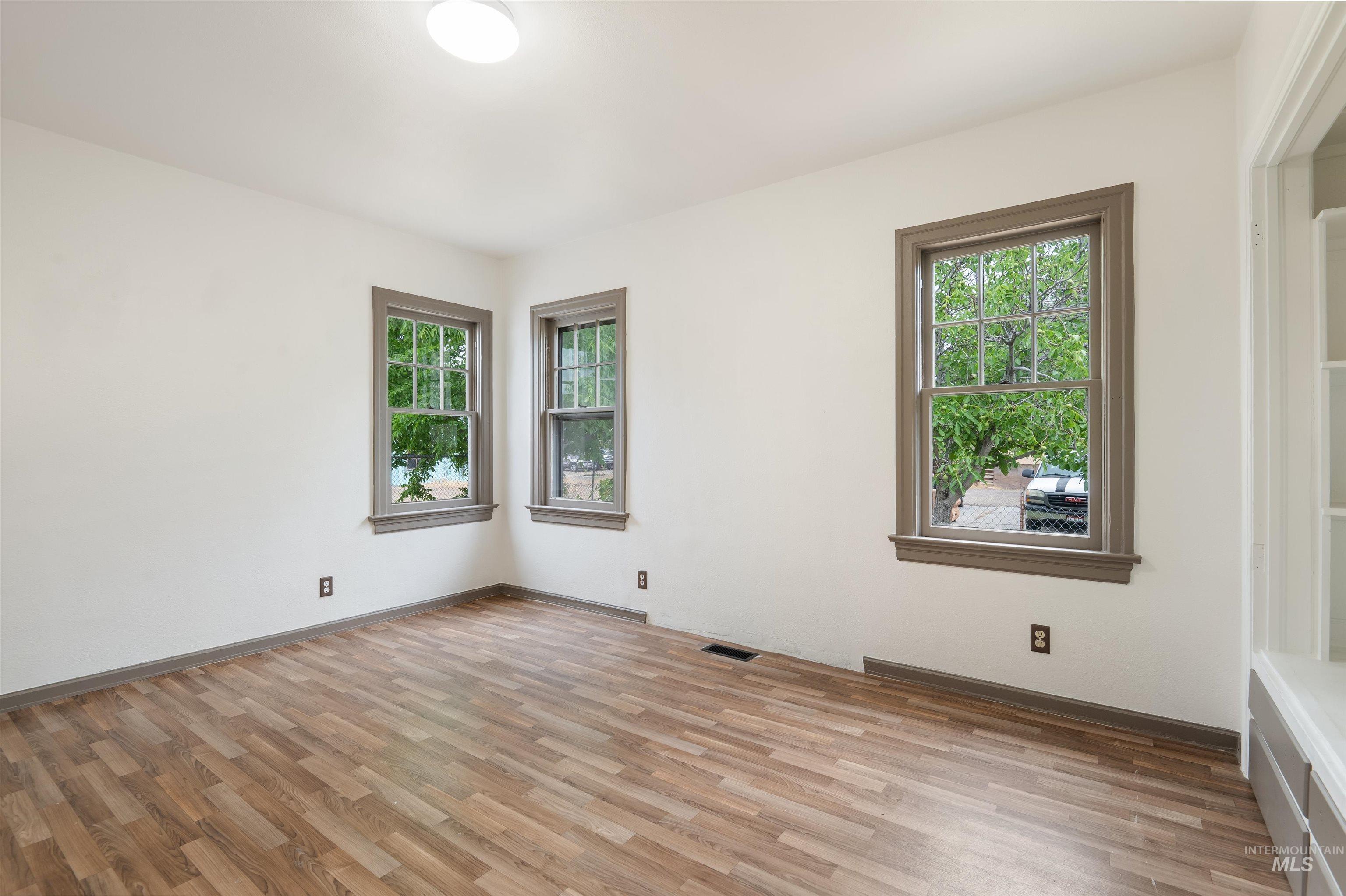 191 Southwest 5th Avenue Ontario, OR 97914 - Photo 16 of 50 Empty room featuring light wood finished floors and baseboards