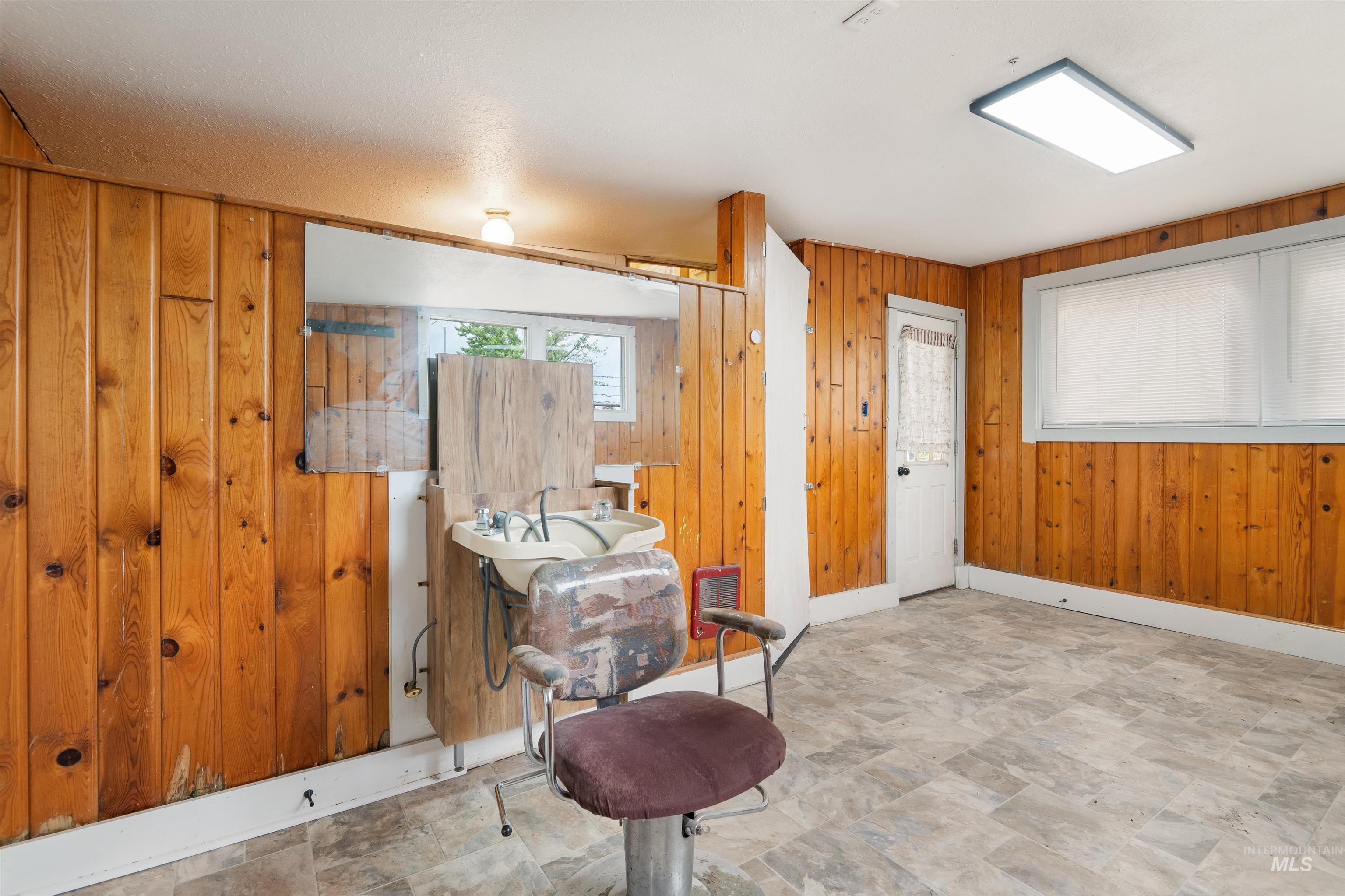 191 Southwest 5th Avenue Ontario, OR 97914 - Photo 32 of 50 Entryway featuring wooden walls and stone finish floors