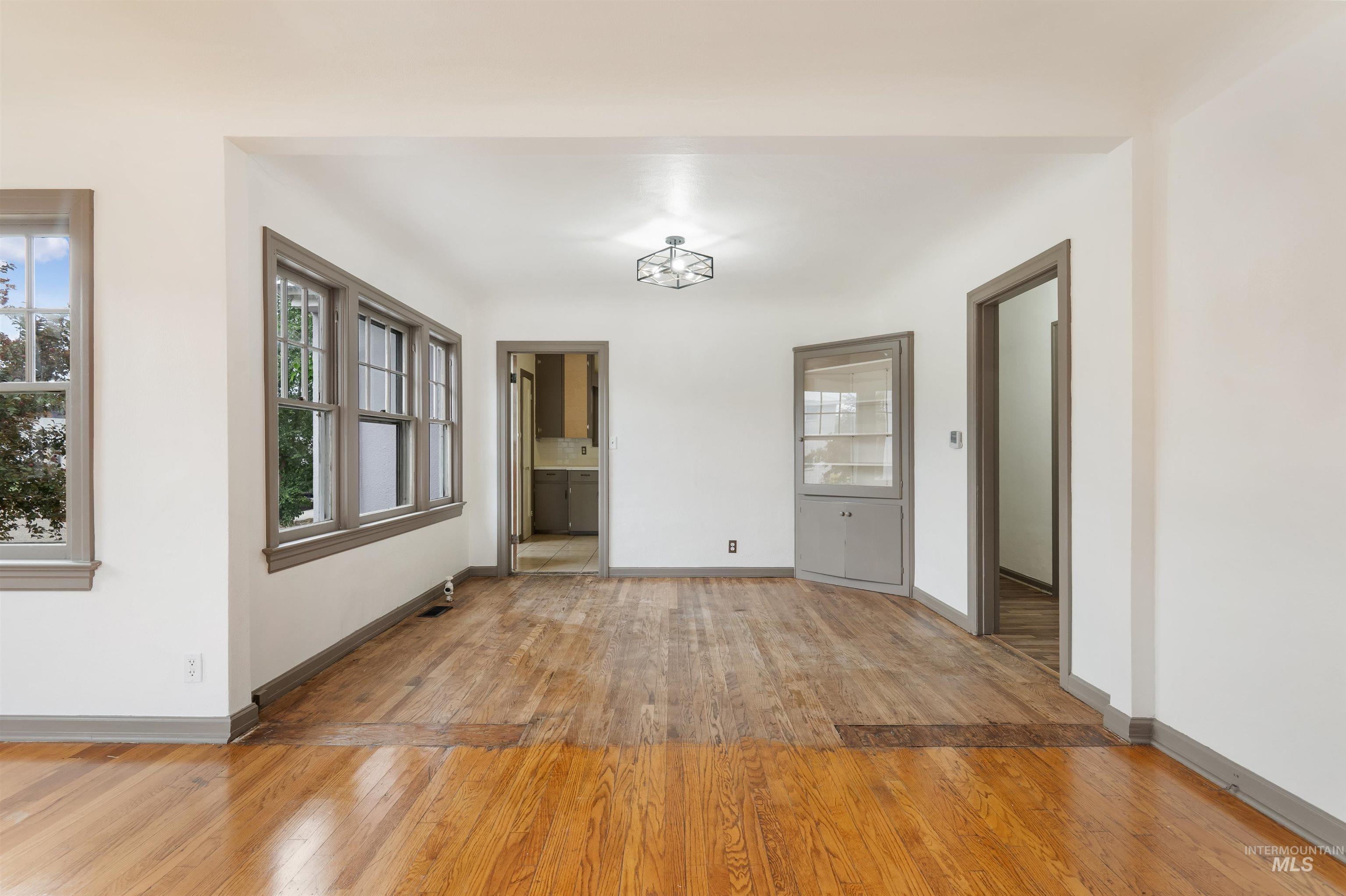 191 Southwest 5th Avenue Ontario, OR 97914 - Photo 9 of 50 Unfurnished dining area featuring light wood-style floors and baseboards