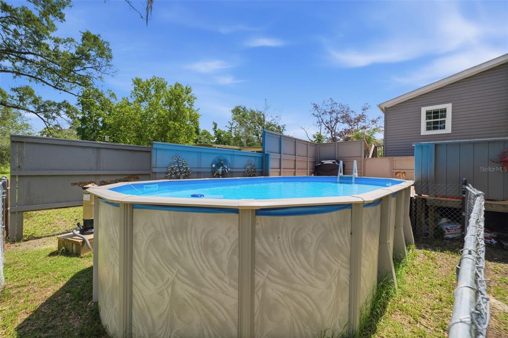 3183 Cedley Road Dade City, FL 33523 - Photo 22 of 48 a view of a swimming pool with a patio