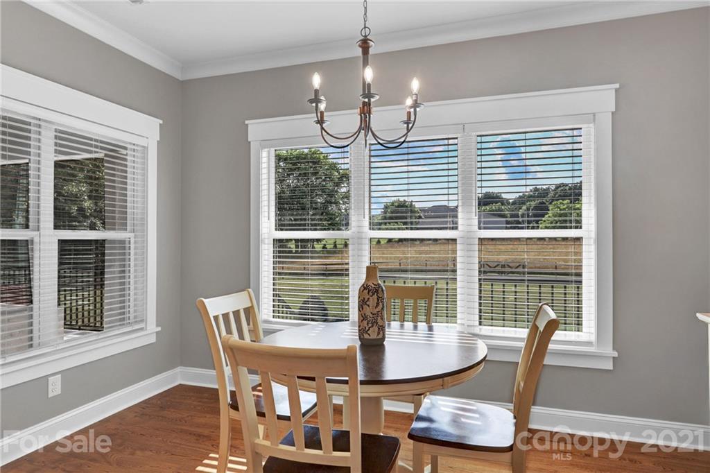 120 Agner Road Salisbury, NC 28146 - Photo 21 of 48 a dining room with furniture a chandelier and wooden floor