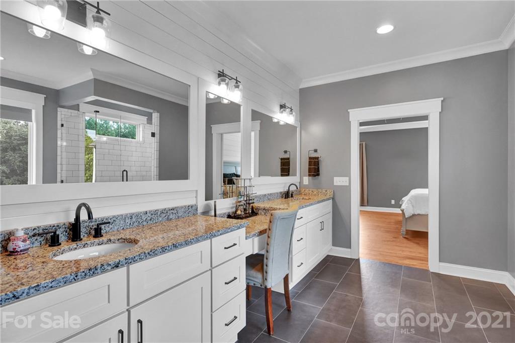 120 Agner Road Salisbury, NC 28146 - Photo 30 of 48 a spacious bathroom with a granite countertop sink and a mirror