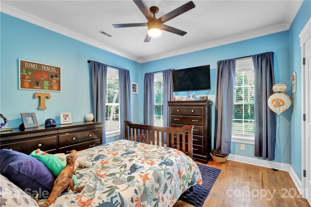 120 Agner Road Salisbury, NC 28146 - Photo 40 of 48 a bedroom with a bed and a flat screen tv