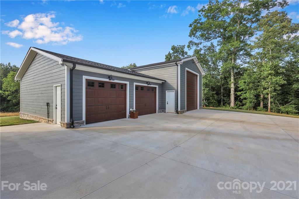 120 Agner Road Salisbury, NC 28146 - Photo 5 of 48 a view of a house with a garage and a yard