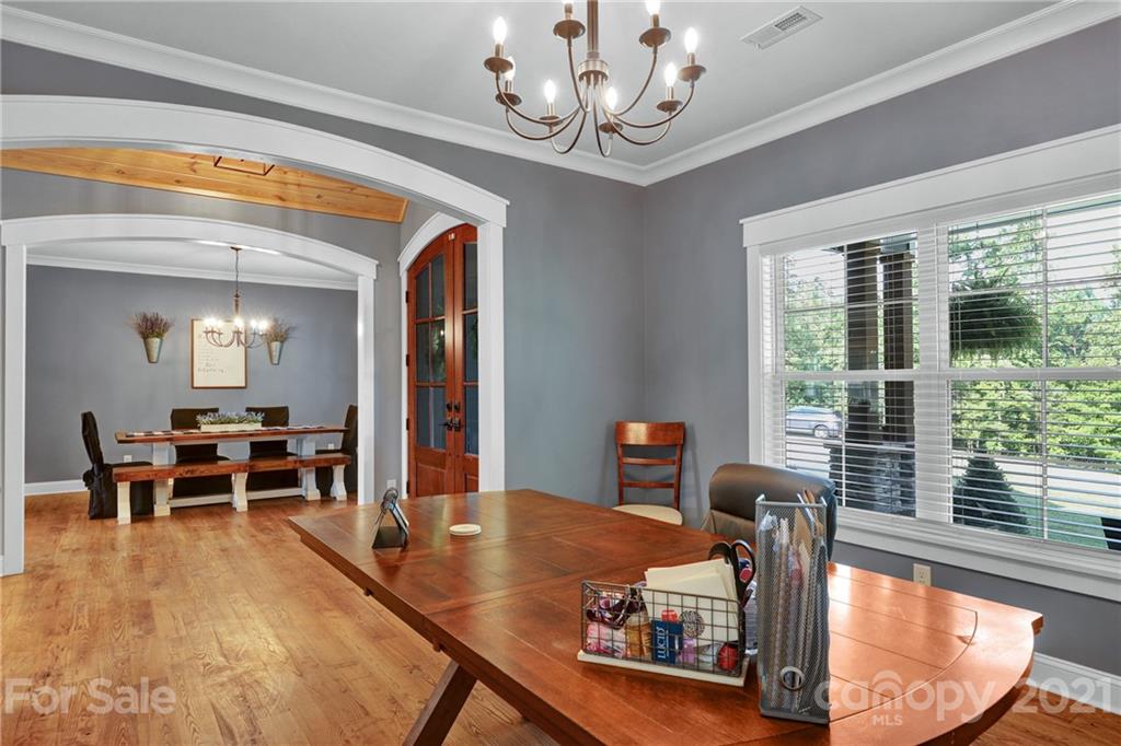 120 Agner Road Salisbury, NC 28146 - Photo 10 of 48 a view of a dining room with furniture a chandelier and wooden floor