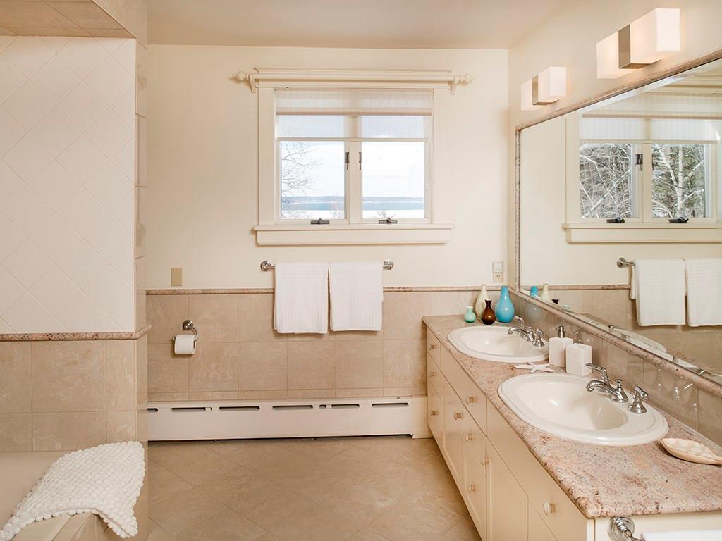 19 Sturdivant Road Cumberland, ME 04110 - Photo 14 of 34 Master bath is tiled and features a...