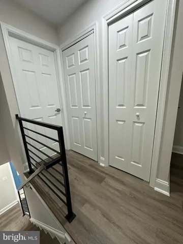 a view of a livingroom with wooden floor