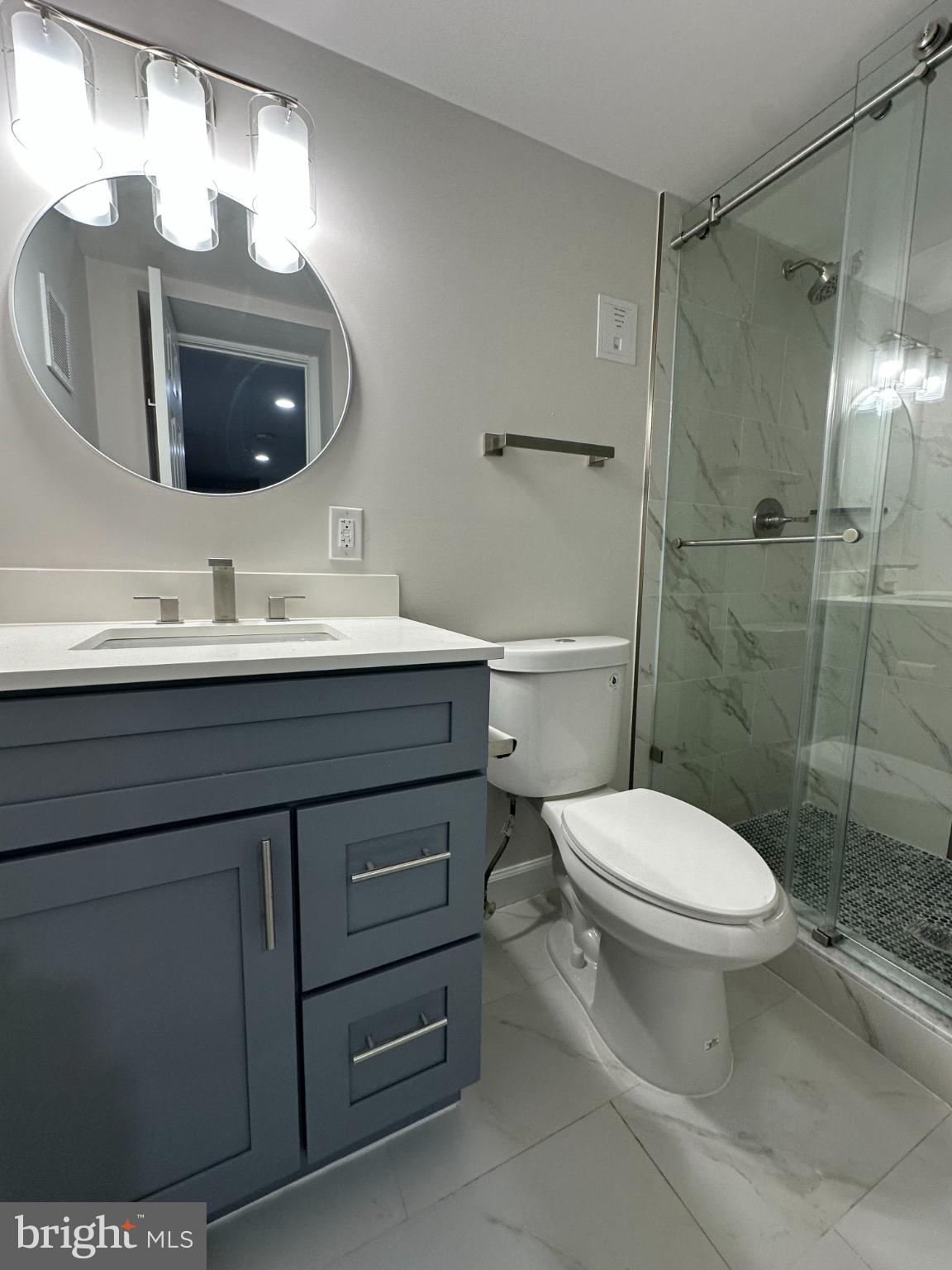 1742 Lyman Place Northeast Washington, DC 20002 - Photo 19 of 30 a bathroom with a toilet sink and mirror