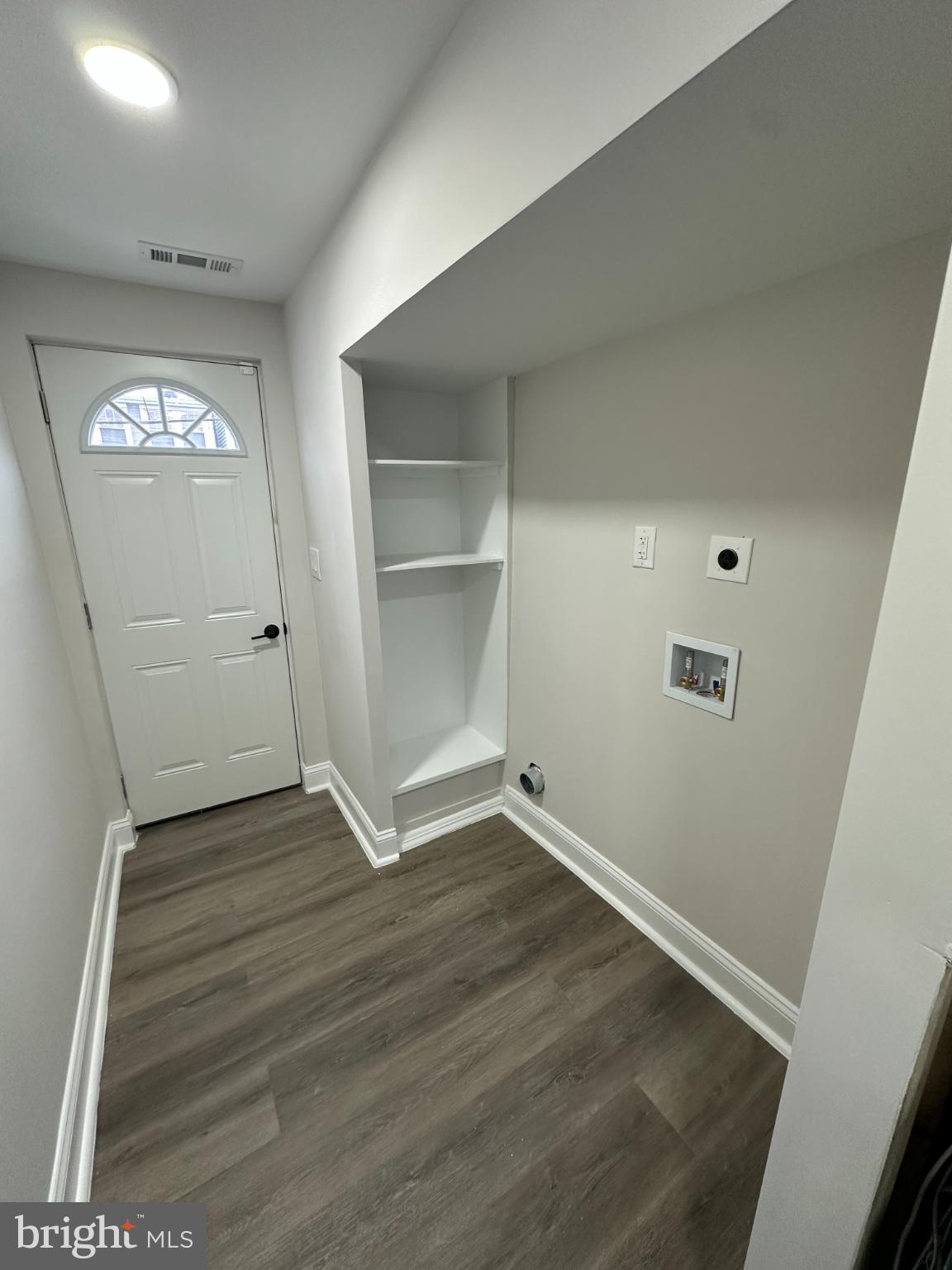 1742 Lyman Place Northeast Washington, DC 20002 - Photo 29 of 30 an empty room with wooden floor and windows