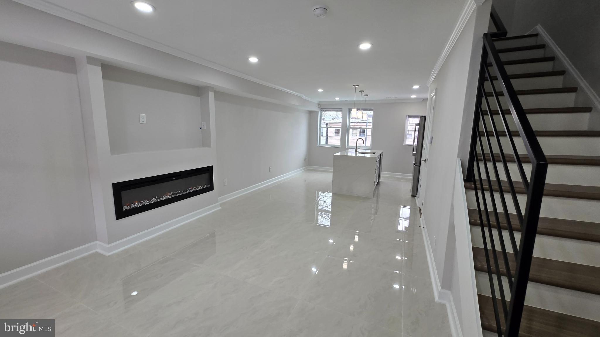 1742 Lyman Place Northeast Washington, DC 20002 - Photo 4 of 30 an empty room with wooden floor and entryway